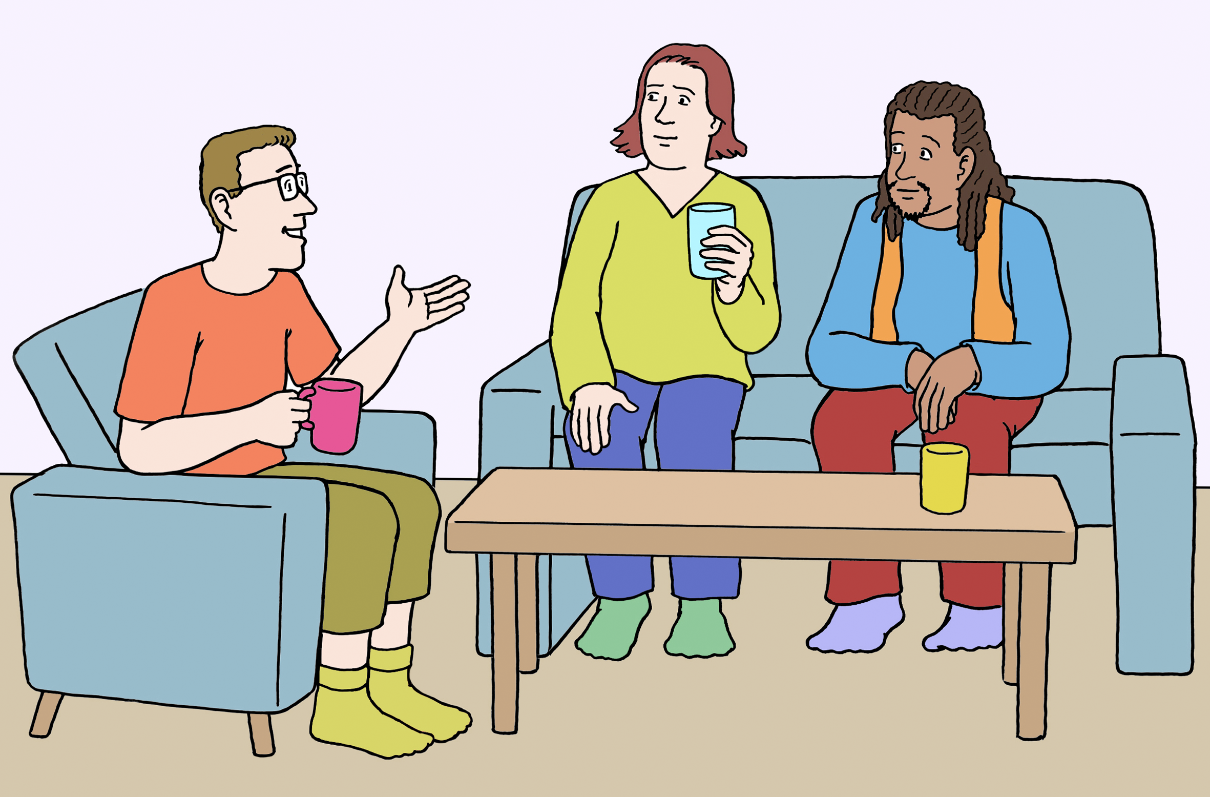 drei Menschen sitzen zusammen auf Sofas und sprechen miteinander